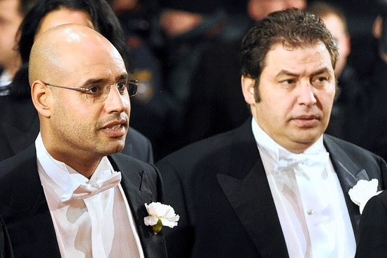 Col. Gadhafis son, Saif al-Islam Gadhafi, on left, with Mustafa Zarti ...